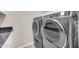 Close up of laundry machines, with a granite counter space at 3925 E Vallejo Dr, Gilbert, AZ 85298
