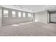 Bright, open living area with plush carpeting and large windows providing natural light at 3925 E Vallejo Dr, Gilbert, AZ 85298