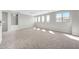 Loft area with neutral walls, carpet flooring and natural light from windows at 3925 E Vallejo Dr, Gilbert, AZ 85298