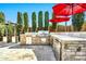 Outdoor kitchen complete with built-in grill, stainless steel refrigerator and stone counter at 3925 E Vallejo Dr, Gilbert, AZ 85298