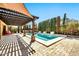 Beautiful backyard pool and spa featuring fountains, a pergola, and outdoor dining area at 3925 E Vallejo Dr, Gilbert, AZ 85298