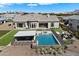Aerial view of backyard featuring a pool, covered patio, and well-manicured landscaping at 4023 E Minton Cir, Mesa, AZ 85215
