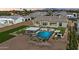 Spacious backyard with a pool, spa, built in grill, and covered patio for outdoor relaxation and entertaining at 4023 E Minton Cir, Mesa, AZ 85215