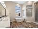 Relaxing bathroom features a soaking tub, picture window, and a glass-block window accent at 4023 E Minton Cir, Mesa, AZ 85215