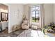 Well-lit Bedroom features a large picture window and an en suite bathroom at 4023 E Minton Cir, Mesa, AZ 85215