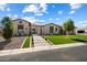 Attractive single-story home with a green lawn, manicured landscaping, and a welcoming stone pathway at 4023 E Minton Cir, Mesa, AZ 85215