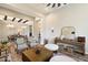 Open-concept living area with neutral tones, stylish furniture, and seamless flow to the dining room at 4023 E Minton Cir, Mesa, AZ 85215