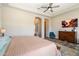 Spacious main bedroom showcasing neutral colors, an arched entrance, and wood-look floors at 4023 E Minton Cir, Mesa, AZ 85215