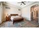 Spacious main bedroom with wood floors and neutral tones, creating a relaxing retreat at 4023 E Minton Cir, Mesa, AZ 85215