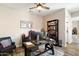 Well-lit office with modern desk, book shelves, and a comfortable chair at 4023 E Minton Cir, Mesa, AZ 85215