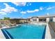 A sparkling pool and spa combination, complimented by an outdoor kitchen and ample patio space at 4023 E Minton Cir, Mesa, AZ 85215