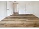 Bedroom features wood floors, neutral paint, and open door to another room at 4111 W Desert Cove Ave, Phoenix, AZ 85029