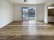 An airy bedroom boasts wood flooring and large sliding glass doors to the outside at 4111 W Desert Cove Ave, Phoenix, AZ 85029