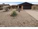 Southwest home with desert landscaping, rock ground cover, and a two-car garage at 4111 W Desert Cove Ave, Phoenix, AZ 85029