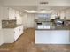 Modern kitchen includes stainless steel appliances, granite countertops, and ample cabinet space at 4111 W Desert Cove Ave, Phoenix, AZ 85029