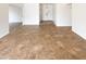 A bright living space featuring tile floors and neutral wall paint at 4111 W Desert Cove Ave, Phoenix, AZ 85029