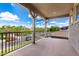 View from balcony with decorative railing overlooking the charming neighborhood and blue sky at 4237 E Sierra Madre Ave, Gilbert, AZ 85296