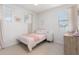 Cozy bedroom with natural light, adorned with simple decor, creating a peaceful and inviting space at 4237 E Sierra Madre Ave, Gilbert, AZ 85296