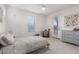 Neutral bedroom featuring carpet, a window, and a door to the outside at 4237 E Sierra Madre Ave, Gilbert, AZ 85296
