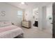 Bright bedroom with dresser and bathroom access at 4237 E Sierra Madre Ave, Gilbert, AZ 85296