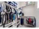 Organized walk-in closet with shelving and hanging rods for ample clothing and accessory storage at 4237 E Sierra Madre Ave, Gilbert, AZ 85296