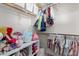 Organized walk-in closet with shelving and clothing racks, perfect for storage at 4237 E Sierra Madre Ave, Gilbert, AZ 85296