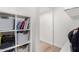 Brightly lit closet featuring built-in shelving for folded items or books at 4237 E Sierra Madre Ave, Gilbert, AZ 85296