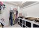 Walk in closet features shelving, clothing racks, shoe storage and ample organizational options at 4237 E Sierra Madre Ave, Gilbert, AZ 85296