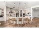 Spacious kitchen with pendant lighting, white cabinets, and island with seating at 4237 E Sierra Madre Ave, Gilbert, AZ 85296