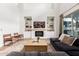 Cozy living room with fireplace, built-in shelving, comfortable seating, and plenty of natural light at 4237 E Sierra Madre Ave, Gilbert, AZ 85296