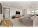 Spacious living area with comfortable seating and plenty of natural light, creating a relaxing atmosphere at 4237 E Sierra Madre Ave, Gilbert, AZ 85296