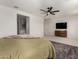 Well-lit main bedroom with a ceiling fan, large window, and spacious layout at 4237 E Sierra Madre Ave, Gilbert, AZ 85296