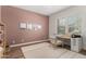 Cozy office space with a wooden desk, accent wall, and natural light from the windows at 4237 E Sierra Madre Ave, Gilbert, AZ 85296