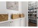 This pantry features adjustable shelving stocked with a variety of food items and paper products for ample storage at 4237 E Sierra Madre Ave, Gilbert, AZ 85296
