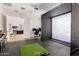 Home rec room with golf simulator and open floor plan to a media room with tv at 4237 E Sierra Madre Ave, Gilbert, AZ 85296