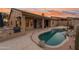 Resort-style backyard featuring a built-in grill, covered patio, and a luxurious pool for outdoor enjoyment at 4413 S Tigre Del Mar Dr, Gold Canyon, AZ 85118