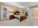 Comfortable bedroom boasts a ceiling fan, stylish decor, and access to the backyard at 4413 S Tigre Del Mar Dr, Gold Canyon, AZ 85118