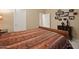 Comfortable bedroom showcasing a patterned comforter, modern decorations, and plenty of natural light at 4413 S Tigre Del Mar Dr, Gold Canyon, AZ 85118