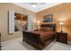 Cozy bedroom with soft lighting, neutral tones, and a large window offering natural light and a peaceful ambiance at 4413 S Tigre Del Mar Dr, Gold Canyon, AZ 85118