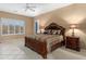Inviting bedroom features a large window, ceiling fan, and comfortable, stylish decor at 4413 S Tigre Del Mar Dr, Gold Canyon, AZ 85118