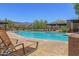 Relaxing community pool with shaded seating areas and mountain views at 4413 S Tigre Del Mar Dr, Gold Canyon, AZ 85118