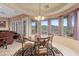 Bright dining area features a round table, desert views, and access to the backyard at 4413 S Tigre Del Mar Dr, Gold Canyon, AZ 85118