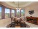 Charming dining area with a round table, views of the desert, and a decorative ceiling at 4413 S Tigre Del Mar Dr, Gold Canyon, AZ 85118