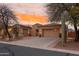 Attractive desert home with well-maintained yard, mature trees, and attached garage at 4413 S Tigre Del Mar Dr, Gold Canyon, AZ 85118