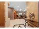 Grand foyer showcasing a decorative console table and views into the living area with a fireplace at 4413 S Tigre Del Mar Dr, Gold Canyon, AZ 85118