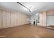Spacious three-car garage with abundant cabinet space and epoxy floors for organized storage and functionality at 4413 S Tigre Del Mar Dr, Gold Canyon, AZ 85118
