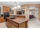 Open kitchen showcases a center island, stainless steel appliances, and seamless access to living spaces at 4413 S Tigre Del Mar Dr, Gold Canyon, AZ 85118
