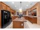 Charming kitchen includes a large island, stainless appliances, and custom cabinetry at 4413 S Tigre Del Mar Dr, Gold Canyon, AZ 85118