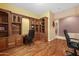 Spacious office with custom built-ins offers hardwood floors and storage for organization at 4413 S Tigre Del Mar Dr, Gold Canyon, AZ 85118