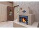 Outdoor fireplace with custom tile design and rustic welcome door at 4413 S Tigre Del Mar Dr, Gold Canyon, AZ 85118